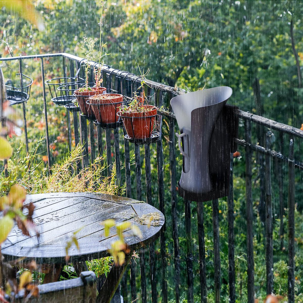 RainBloom Mini mounted to a garden balcony railing in the rain